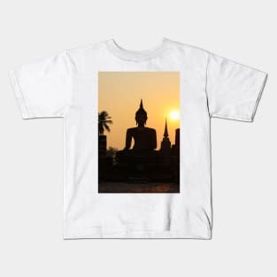 Buddha statue against sunset silhouette Kids T-Shirt